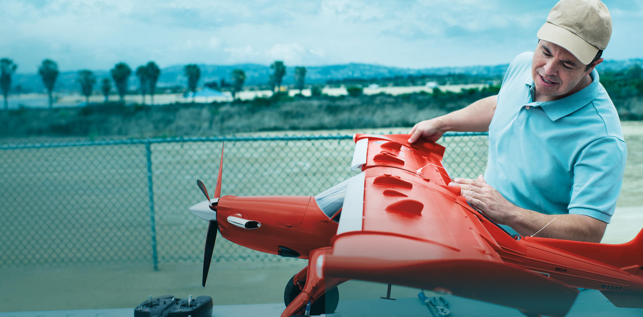 Ambassador Jared with model plane-image