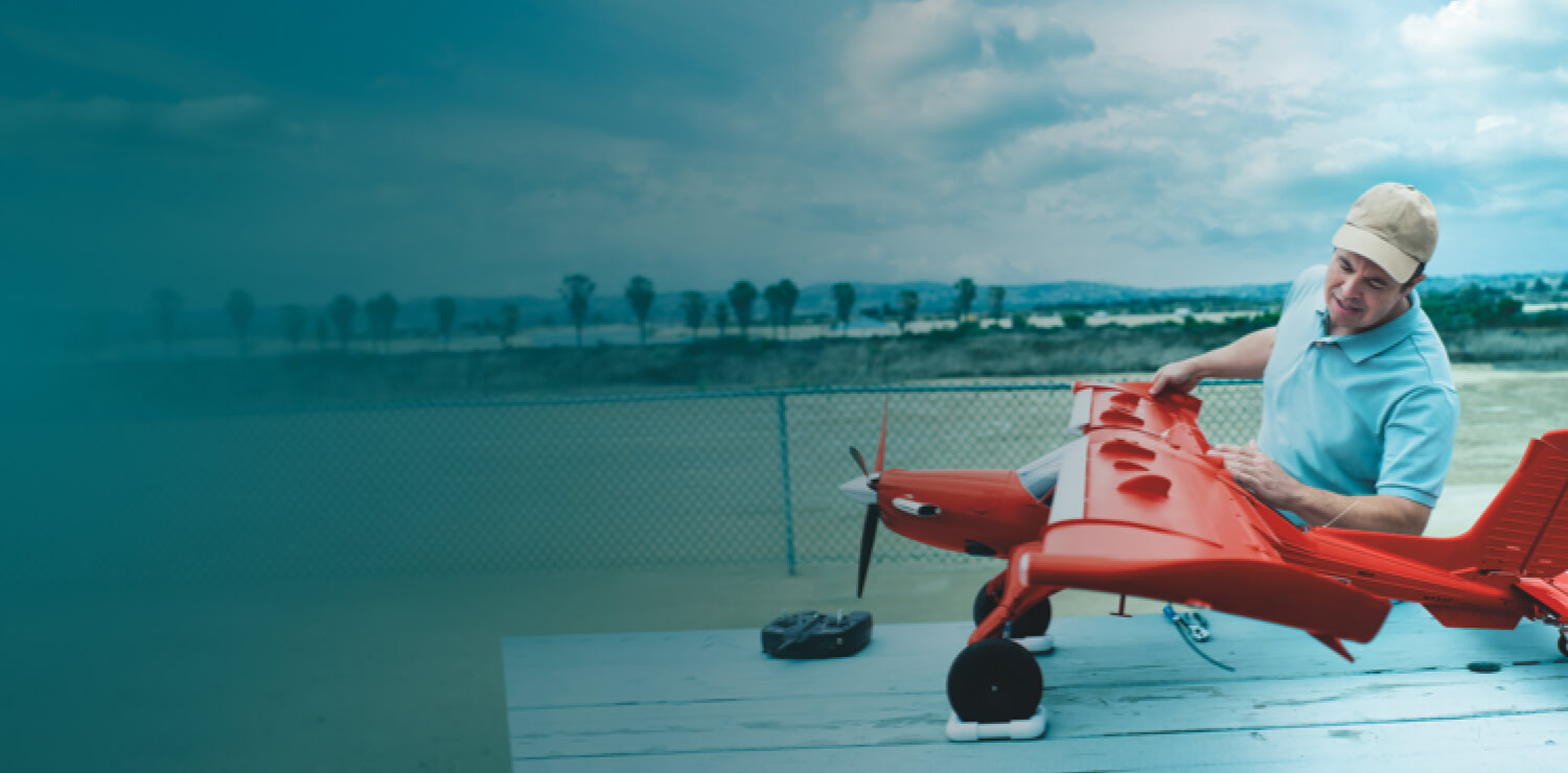 Ambassador Jared with model plane-image